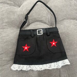 Black Mini Skirt-Style Shoulder Bag with Red Star Accents